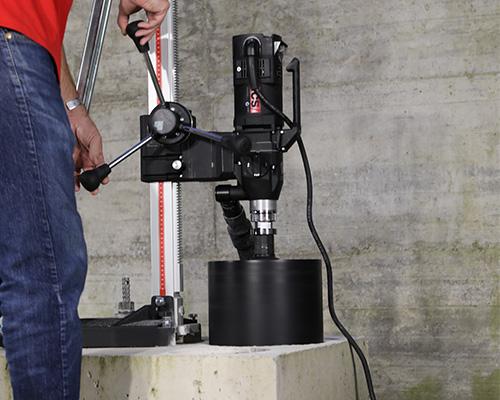 Image of Core Drill Motor on Stand with Core Bit attached